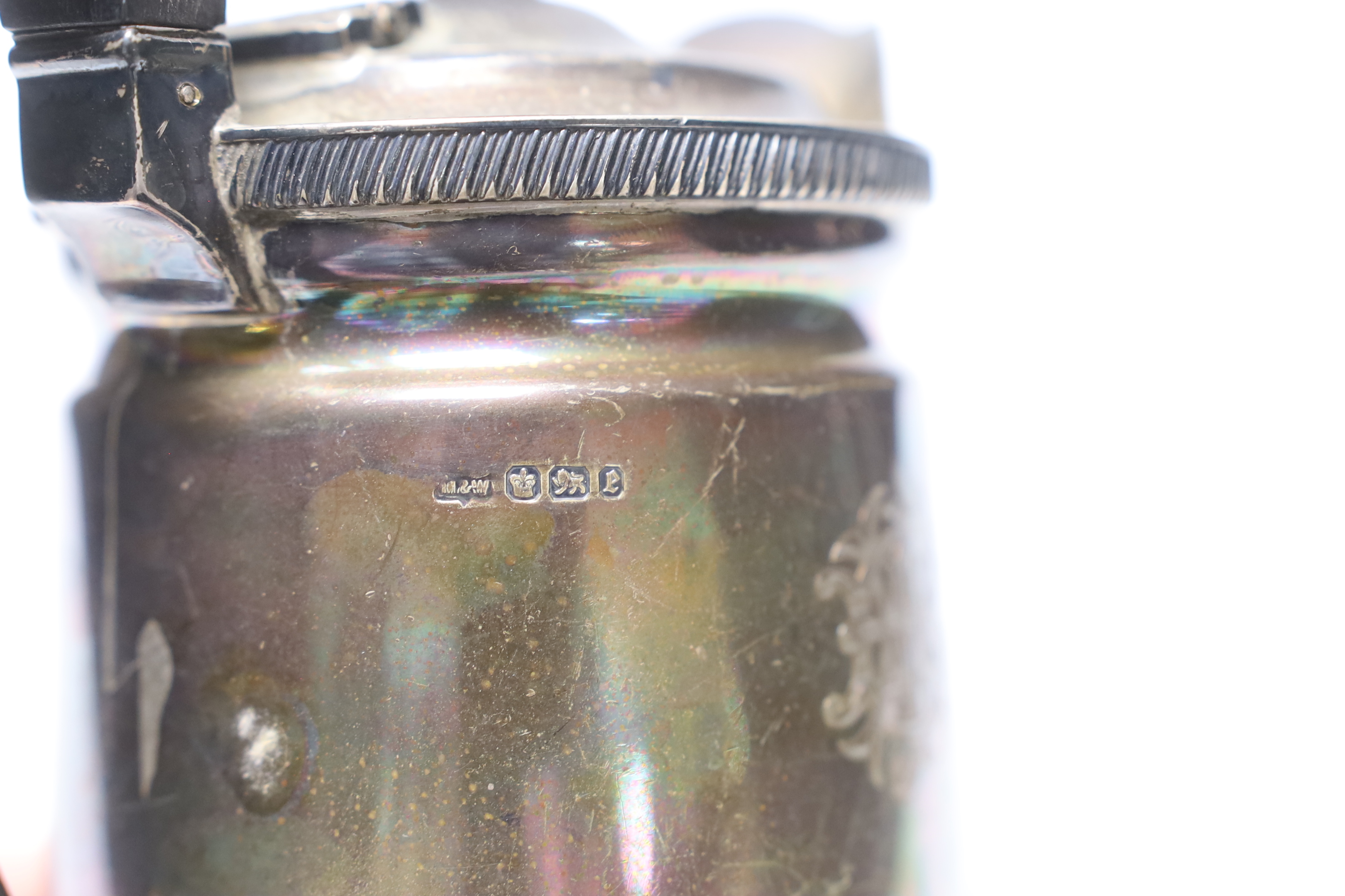 A late Victorian demi-fluted silver hot water jug, Mappin & Webb, Sheffield, 1897, gross weight 17.6oz.